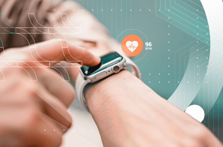 Person touching a smartwatch displaying a heart rate of 96 bpm.