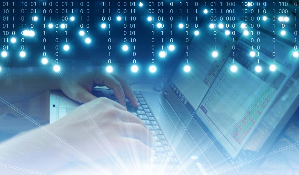 Person typing on laptop with binary code background.