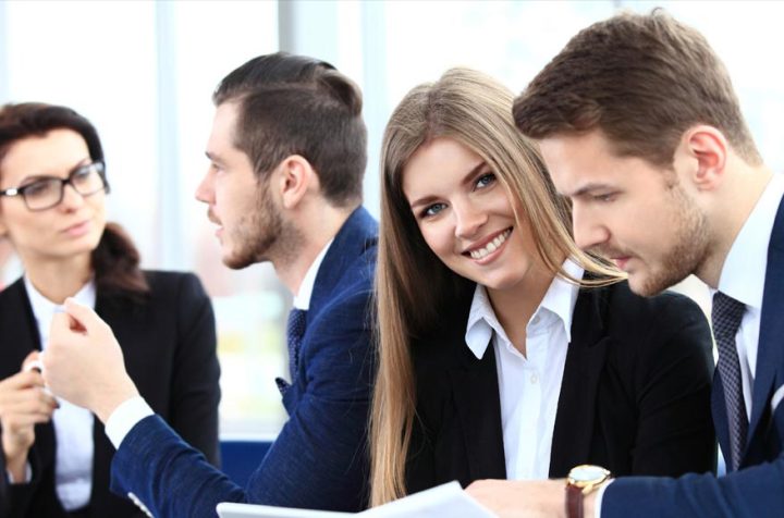Group of business people working together in an office.