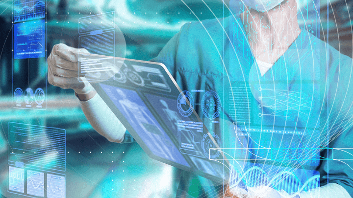 Surgeon holding a virtual screen with medical data and charts.