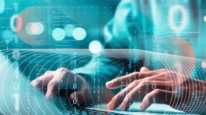 Programmer&rsquo;s hands on a keyboard, surrounded by code and binary numbers.