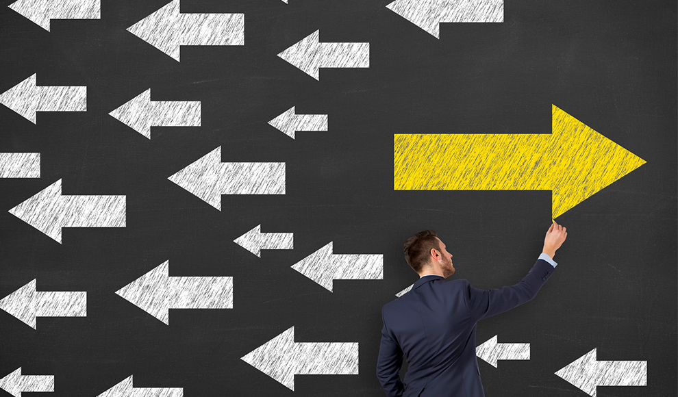 Man drawing a large yellow arrow pointing to the right.