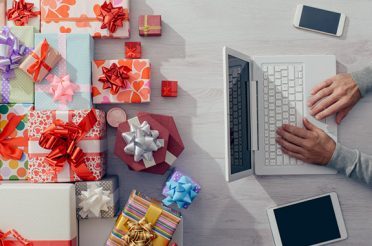 Person using a laptop to order gifts online.