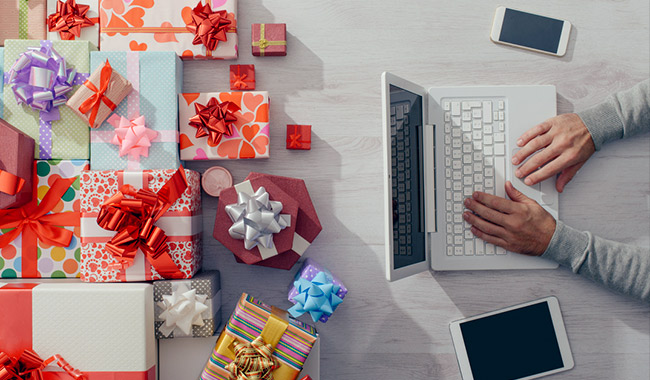 Person using a laptop to order gifts online.