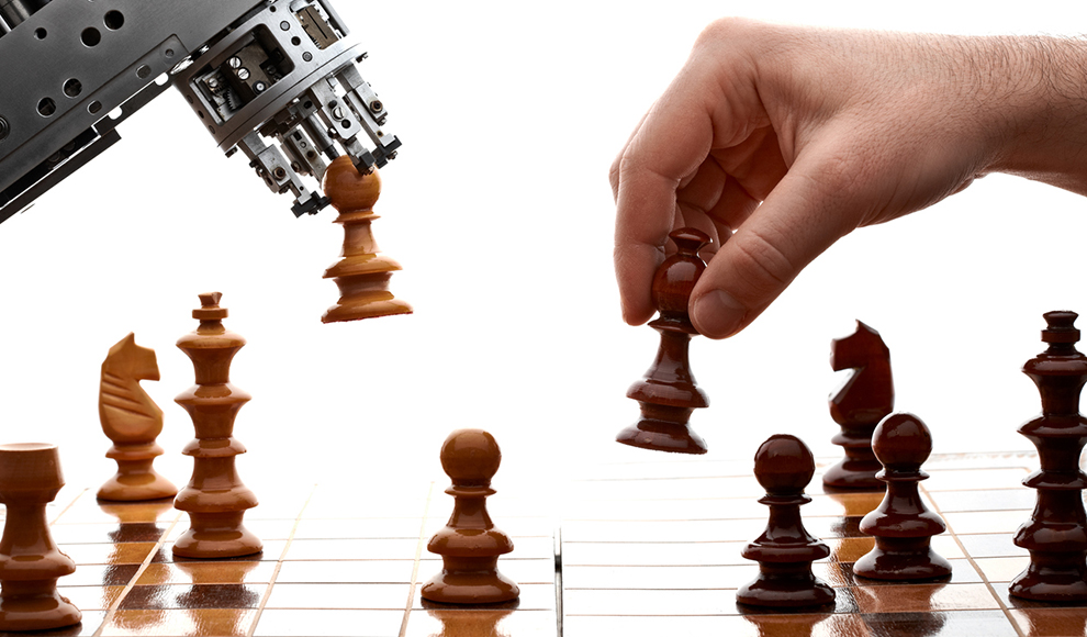 Robot and human playing chess.