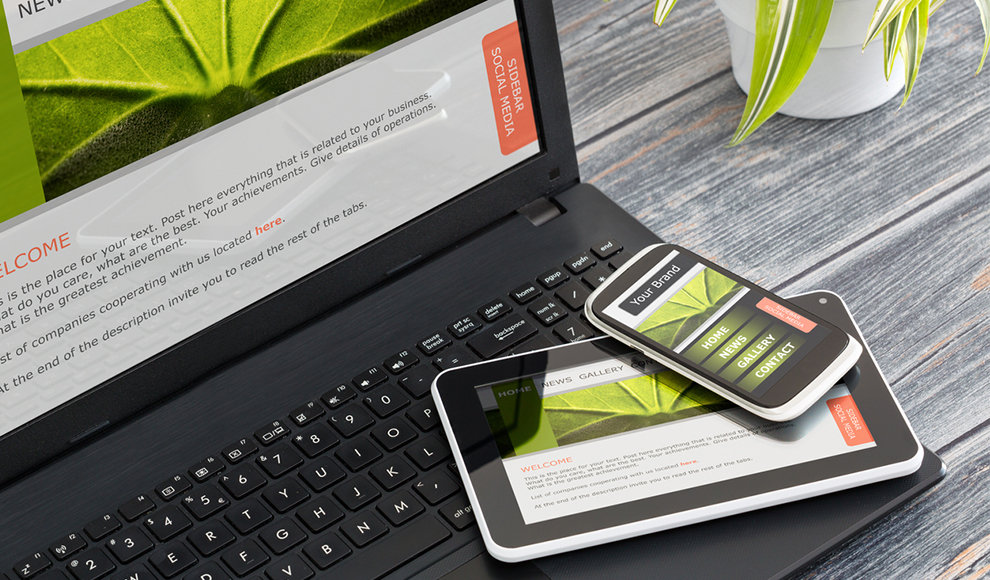 Laptop, phone, and tablet displaying the same webpage.
