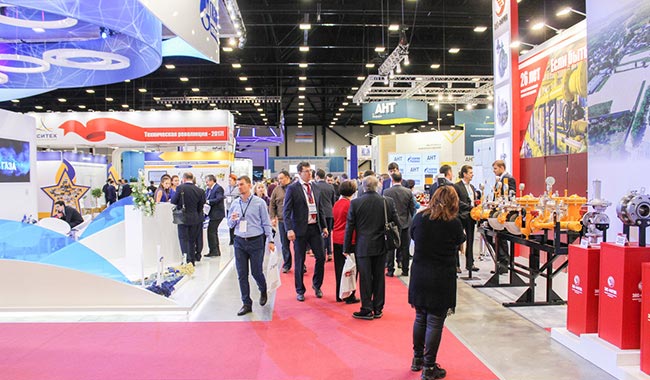 Large group of people at a business expo or conference.