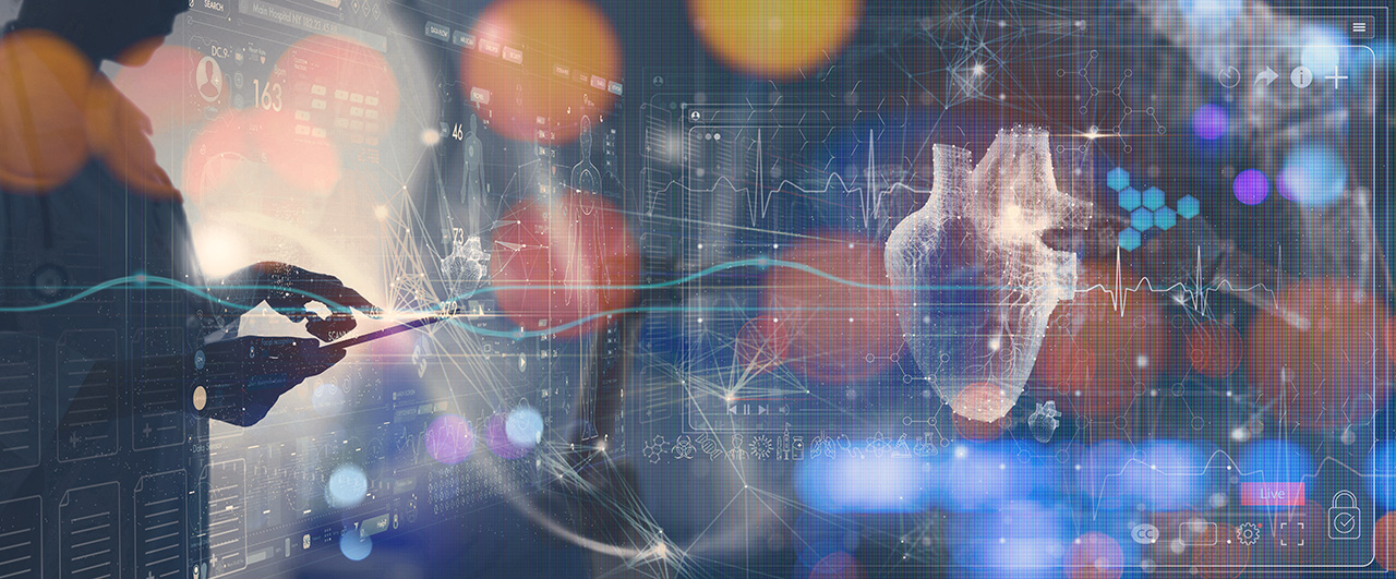 Person viewing a heart hologram with charts on a monitor.