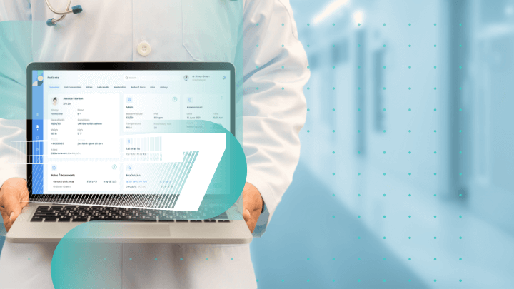 Doctor holding a laptop displaying patient medical information.