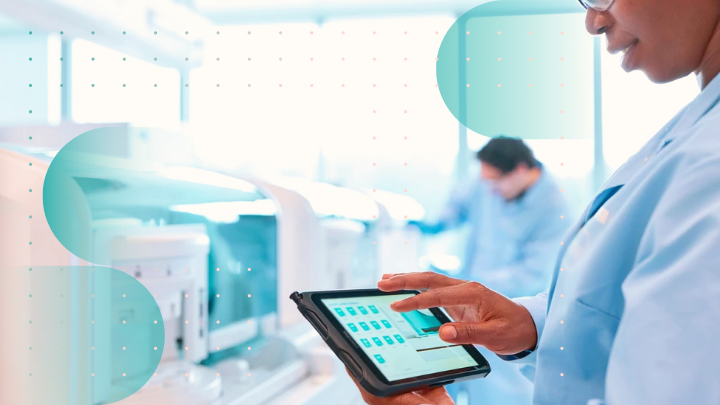 Scientist working on a tablet in a laboratory.