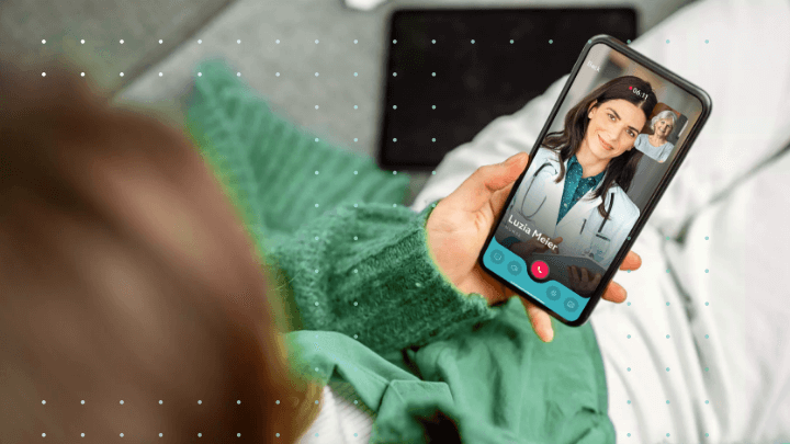 Patient conducting a video call with a doctor on a smartphone.