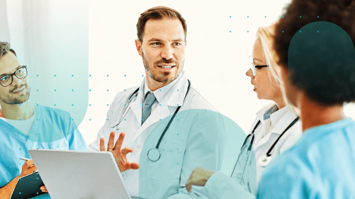 Group of three doctors discussing a case in a hospital.