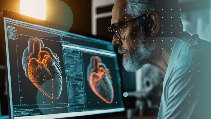 Doctor analyzing a 3D heart scan on a large screen.
