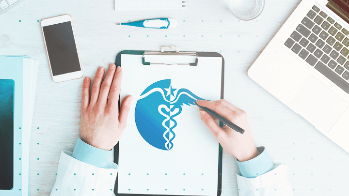 Doctor writing on a sheet with the logo of a medical organization.