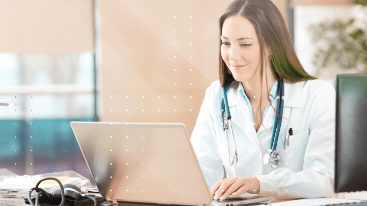 Young female doctor working with a laptop in a medical office.