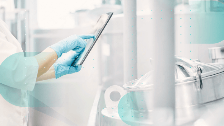 Medical professional wearing gloves using a tablet in a laboratory.