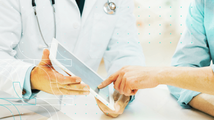Doctor and patient reviewing results on a tablet.