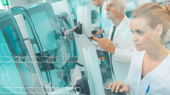 Team of scientists working in a laboratory with medical equipment.