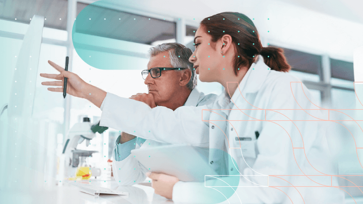 Scientists: two scientists in a laboratory reviewing data on a computer.