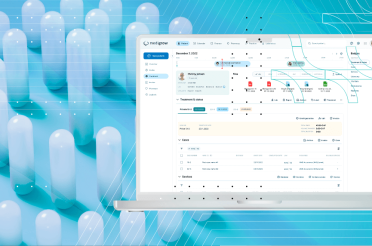 Medical data management software on a laptop with capsules.