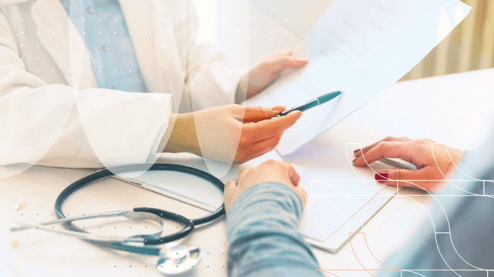 Doctor discussing documents with a patient.