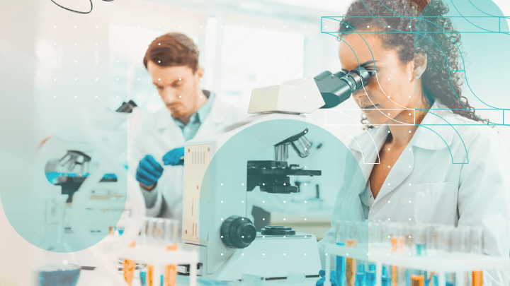 Scientists in a laboratory working with a microscope and test tubes.