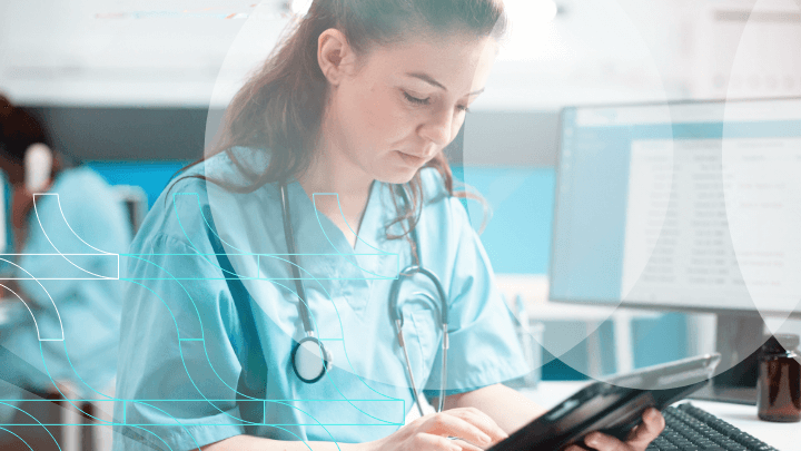 Doctor using a tablet with holographic medical data icons.