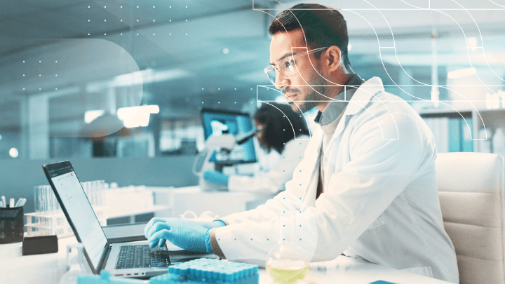 Scientist working on a laptop in a laboratory.