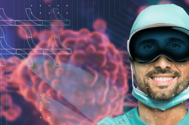 Smiling surgeon wearing VR goggles against a background of enlarged cells.