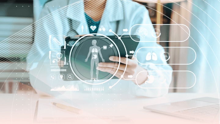 Doctor using a tablet, displaying a hologram of the human body.
