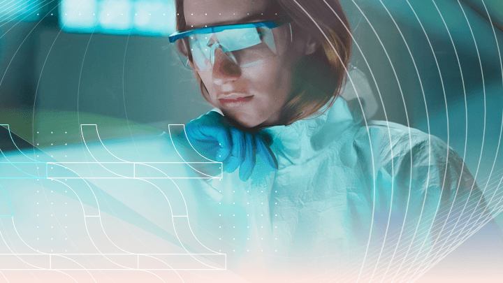 Scientist in safety goggles and gloves working in a laboratory.