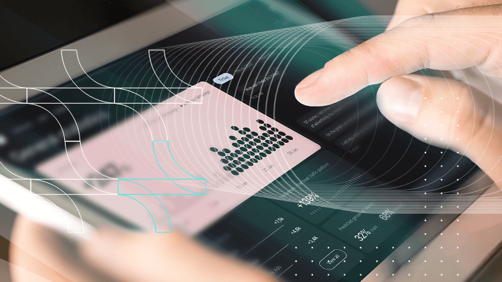 Person using a tablet to analyze data with graphs.
