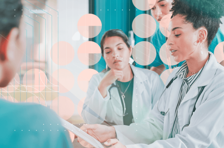 Group of doctors and nurses discussing medical records in a hospital.