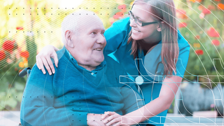 Nurse caring for an elderly man in a wheelchair.