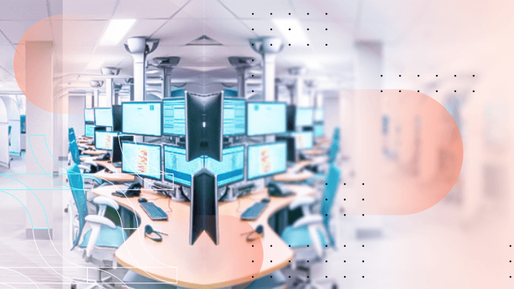 Large hall with numerous computers and monitors, symbolizing a data center.