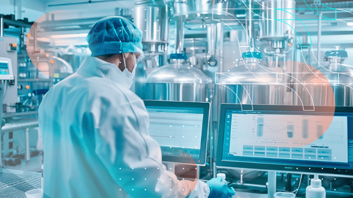 Scientist in a laboratory working on a computer.