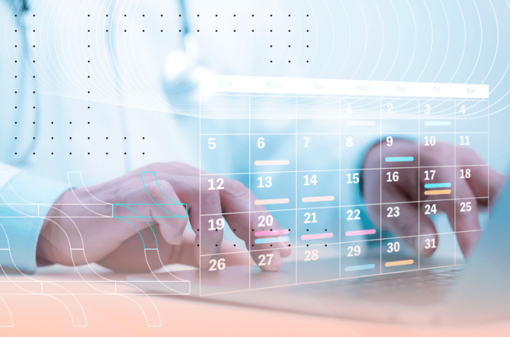 Doctor’s hands managing an electronic calendar with scheduled appointments.