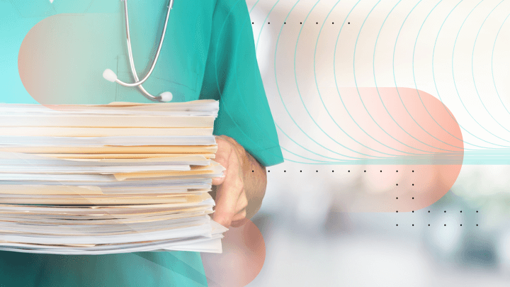 Medical professional holding a stack of paper files, symbolizing bureaucracy in healthcare.