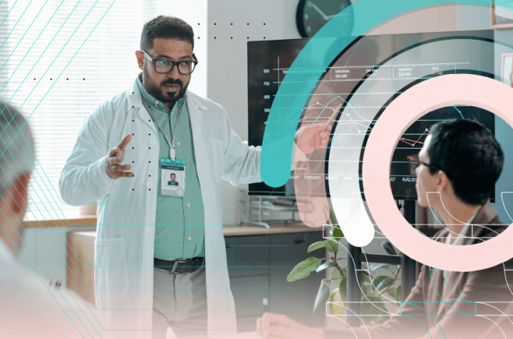 Medical professional giving a presentation with data to colleagues using a large screen.