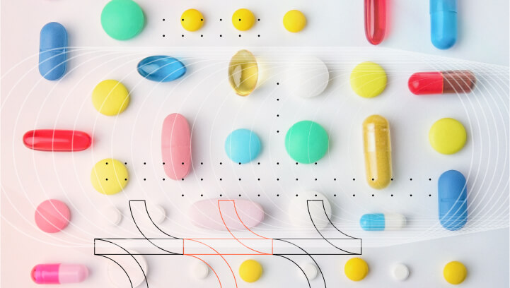 Various colorful pills and capsules on a white background.