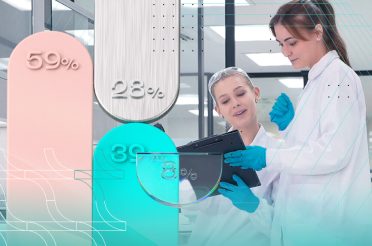 Two laboratory researchers in white coats analyzing clinical trial data with 3D charts and percentages.
